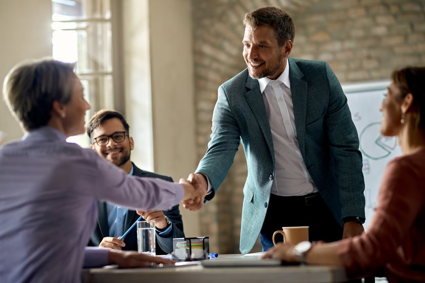 business-coworkers-shaking-hands-meeting-office-focus-is-businessman