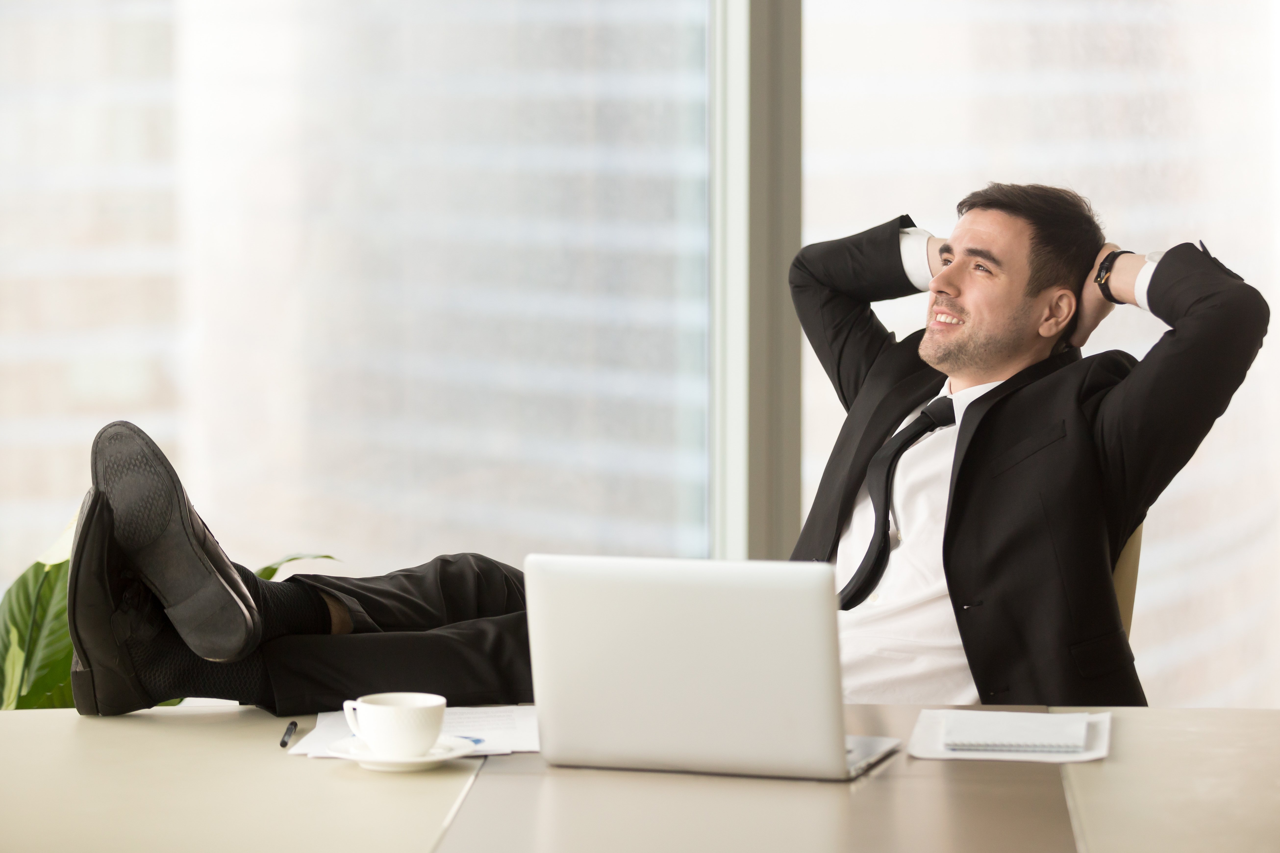 company-director-relaxing-workplace-office